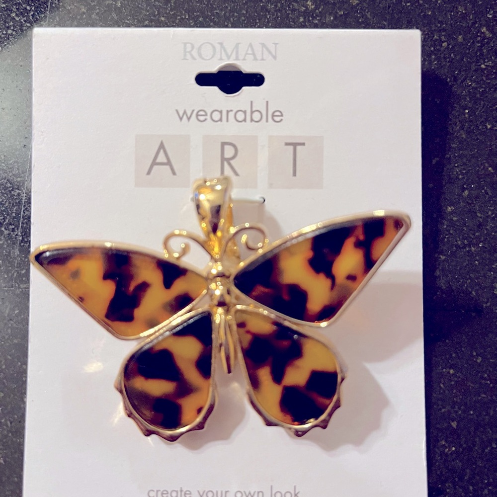 Leopard print butterfly pendant
